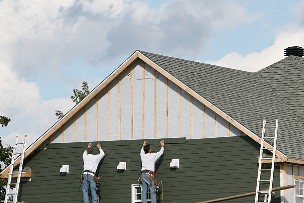 Professional Siding technician working in Medfield, MA